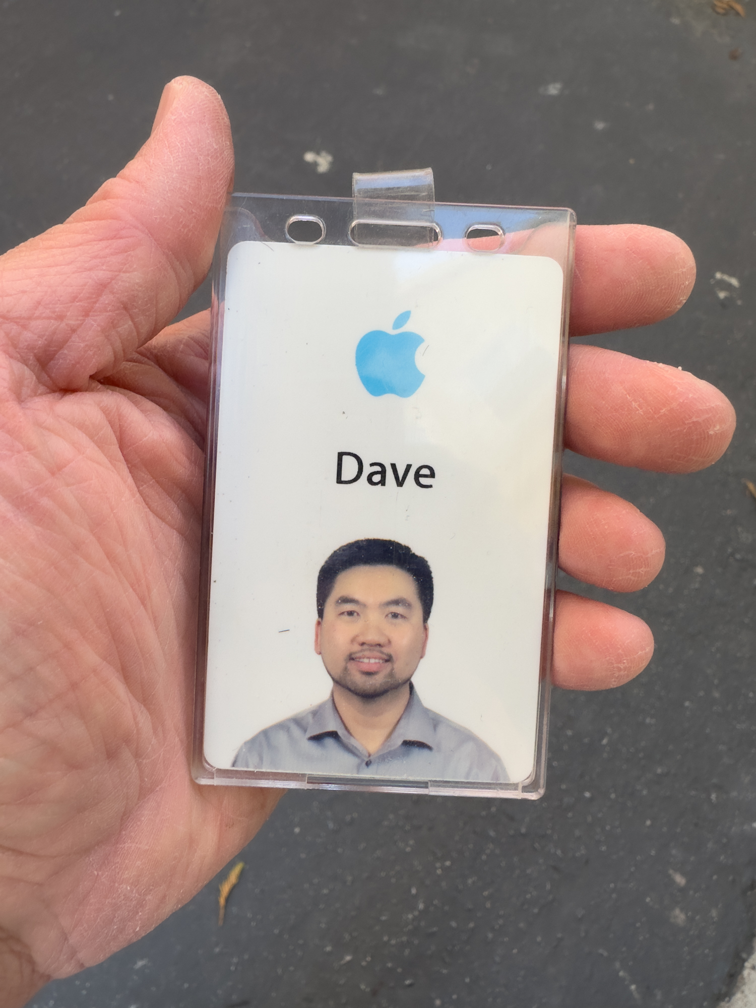 Dave’s Apple badge held in hand